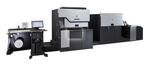 A large printer with two large machines in front of it.