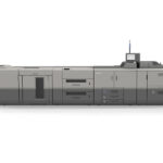 A large printer is shown with the door open.