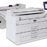 A printer that is sitting on top of a table.