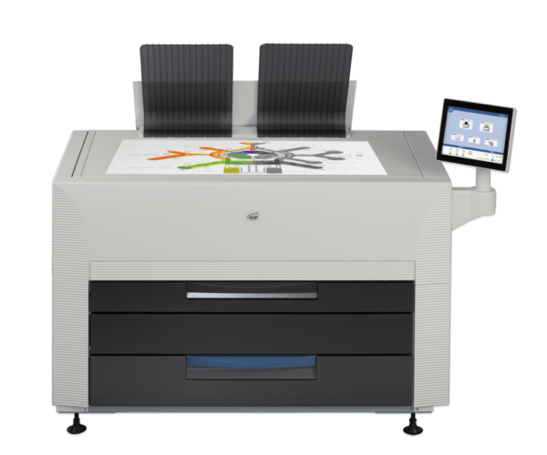 A printer with two chairs on top of it.