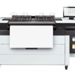 A large printer with two large trays on top of it.