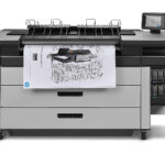 A large printer with some drawings on it