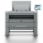 A printer with the top open and a tablet on it.