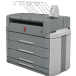 A large printer with many drawers and some papers