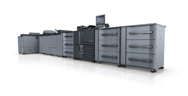 A large printer is lined up with many drawers.