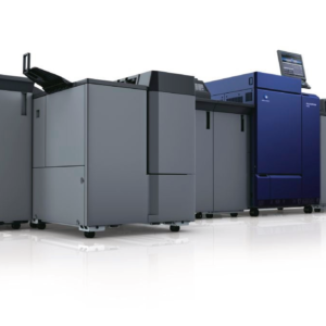 A group of large printers in a room.