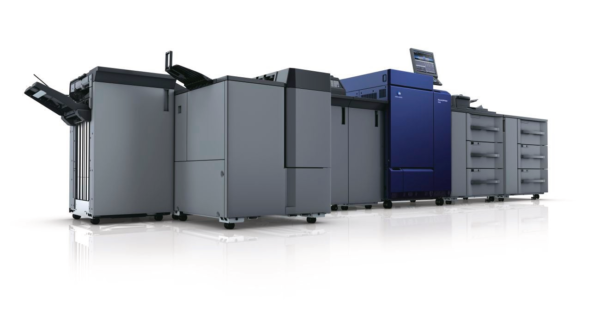 A group of large printers in a room.