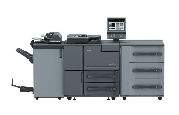 A large printer with two drawers and three cabinets.