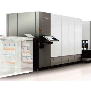 A large machine is shown with papers on the side.