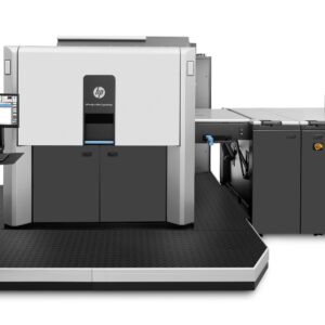 A large printer is shown with the machine in front of it.