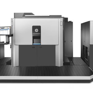 A large printer is shown in front of a wall.