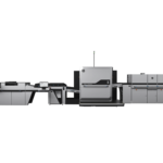 A black and white photo of an office with a large printer.