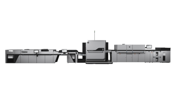 A black and white photo of an office with a large printer.