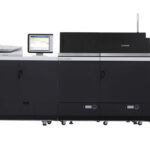 A large printer with two large drawers and one larger drawer.