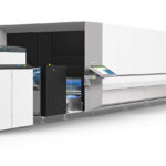 A large printer is shown with its doors open.
