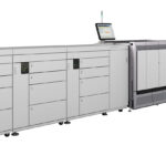 A large printer with two large drawers and one larger drawer.