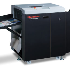 A large black and white printer with papers on the side.