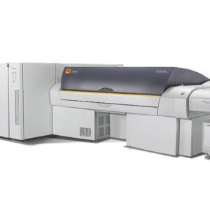 A large printer is sitting next to a larger machine.