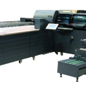 A large printer and some other machines in a room.